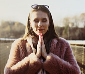 Woman bowing in gratitude