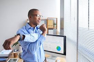 person doing stretching exercise at work