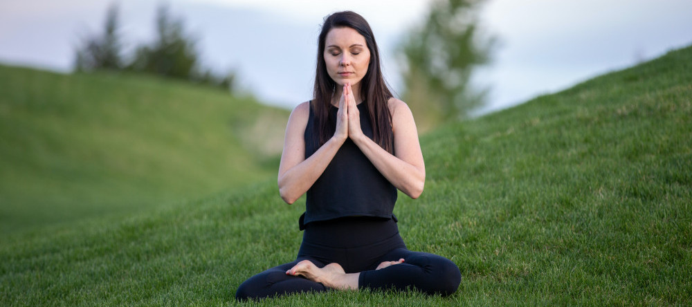 Woman sitting in meditation posture