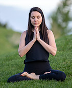 Woman sitting in lotus posture