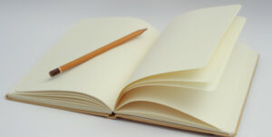 open journal with pencil